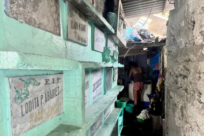 Leben mit den Toten - Der Friedhof-Slum von Manila - Wäsche waschen zwischen Gräbern - Normalität auf dem Manila North Cemetery.