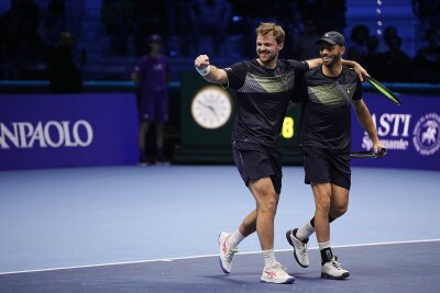 "Tennis Sensation" - Krawietz/Pütz feiern historischen Titel - Kevin Krawietz (l) und Tim Pütz (r) gelang ein Stück deutsche Tennis-Geschichte.